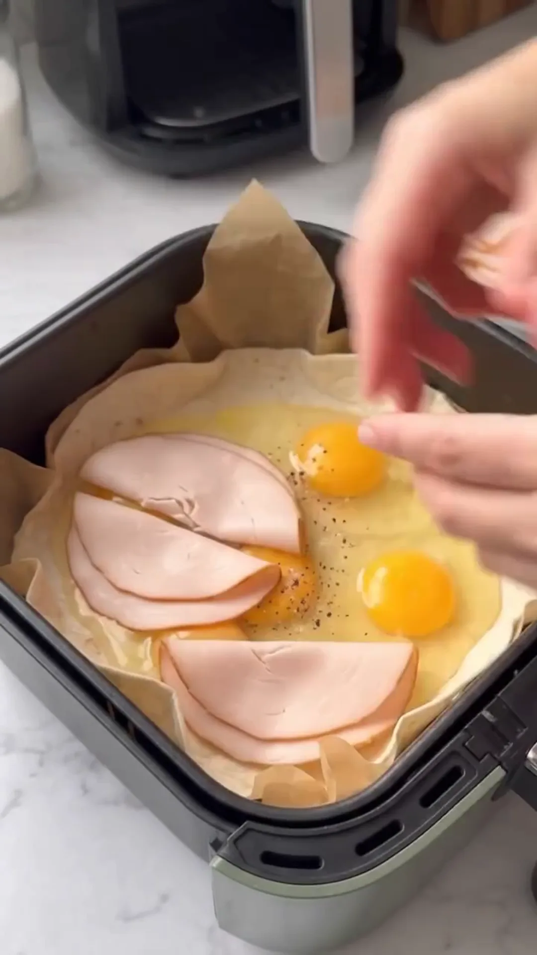 Air Fryer Smoked Turkey, Tomato & Mozzarella Tortilla – placing ingredients in an air fryer basket