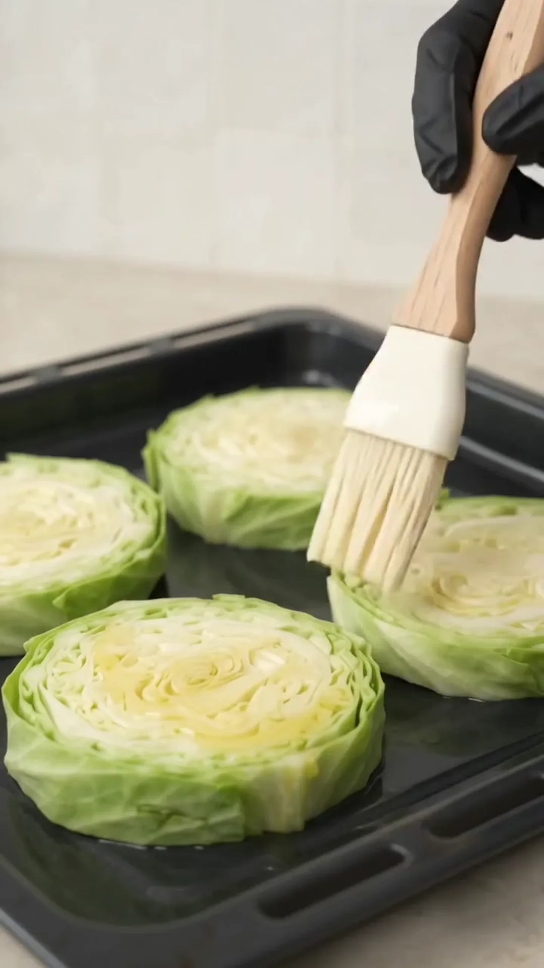 Baked Cabbage Steaks with Ground Beef, Tomato and Cheese – brushing cabbage slices with oil or sauce