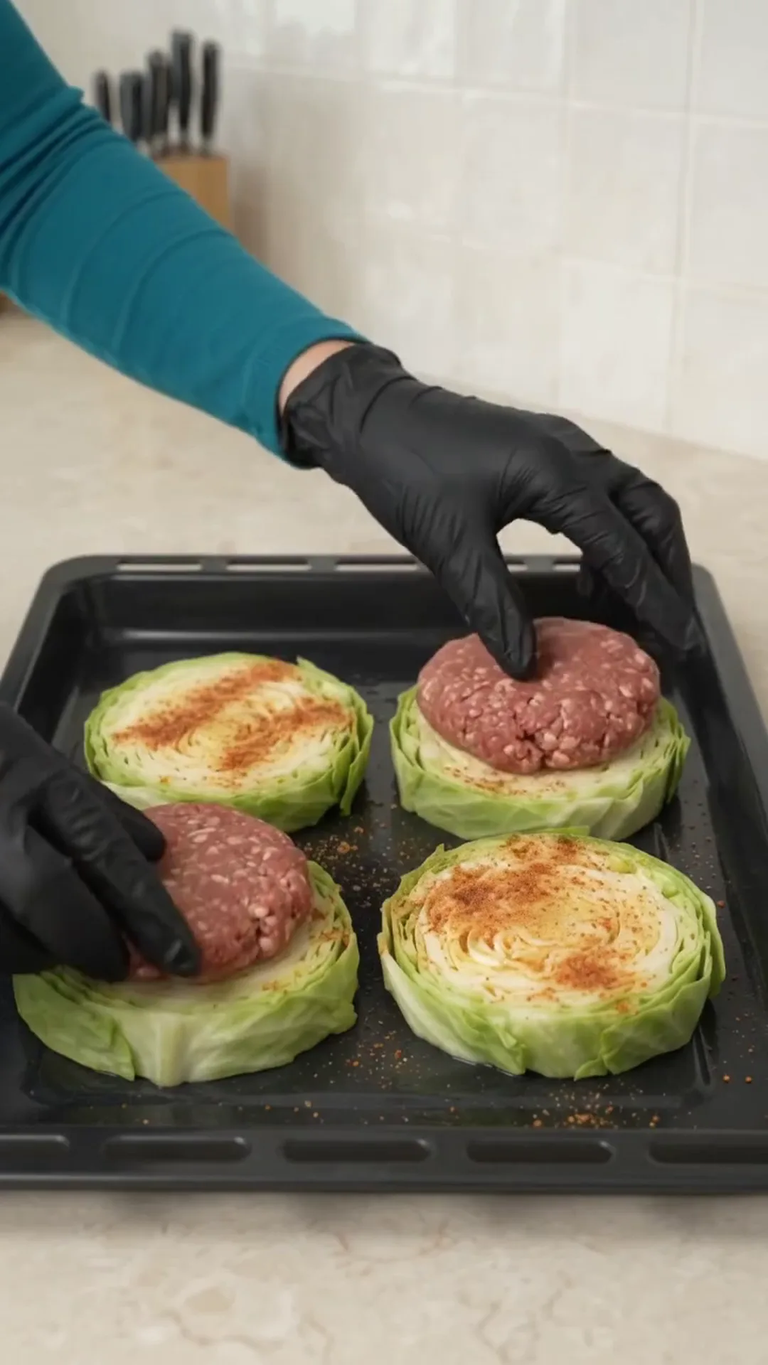 Baked Cabbage Steaks with Ground Beef, Tomato and Cheese – placing raw burger patties on cabbage slices