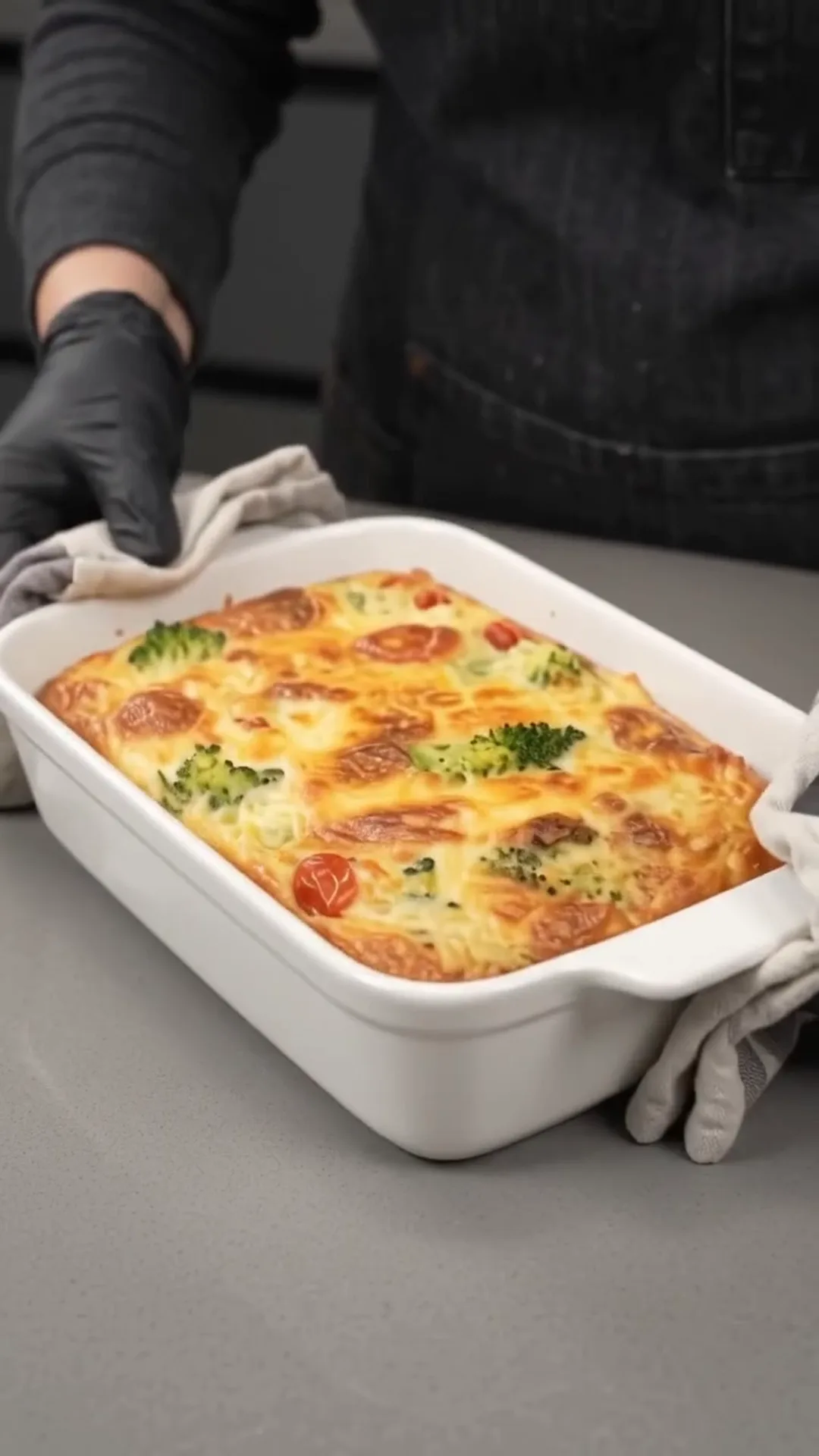 Cheesy Broccoli Meat Stacks with Roasted Cauliflower – removing dish from oven