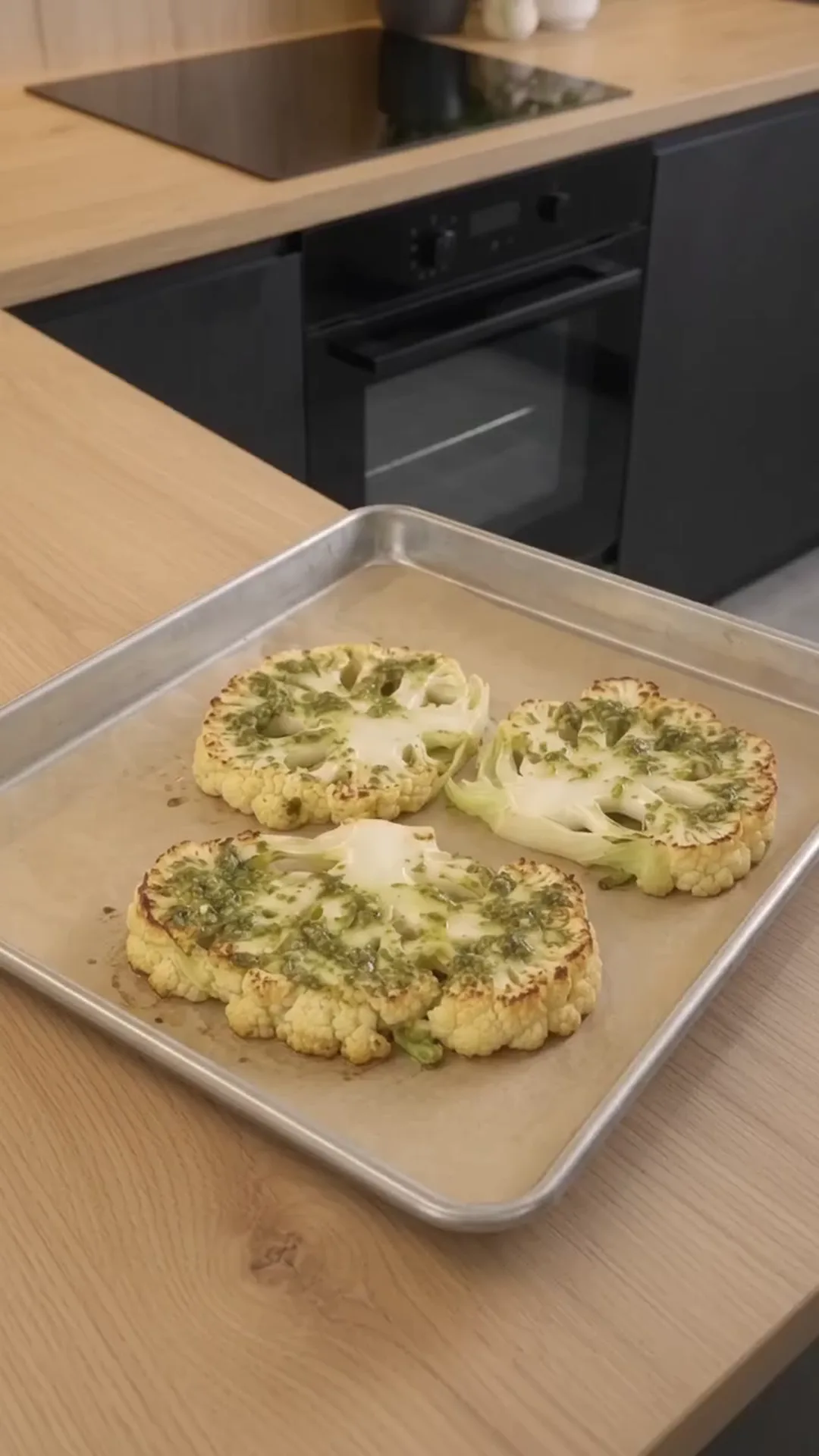 Cheesy Pesto Caprese Cauliflower Steaks – Roasting cauliflower steaks in the oven