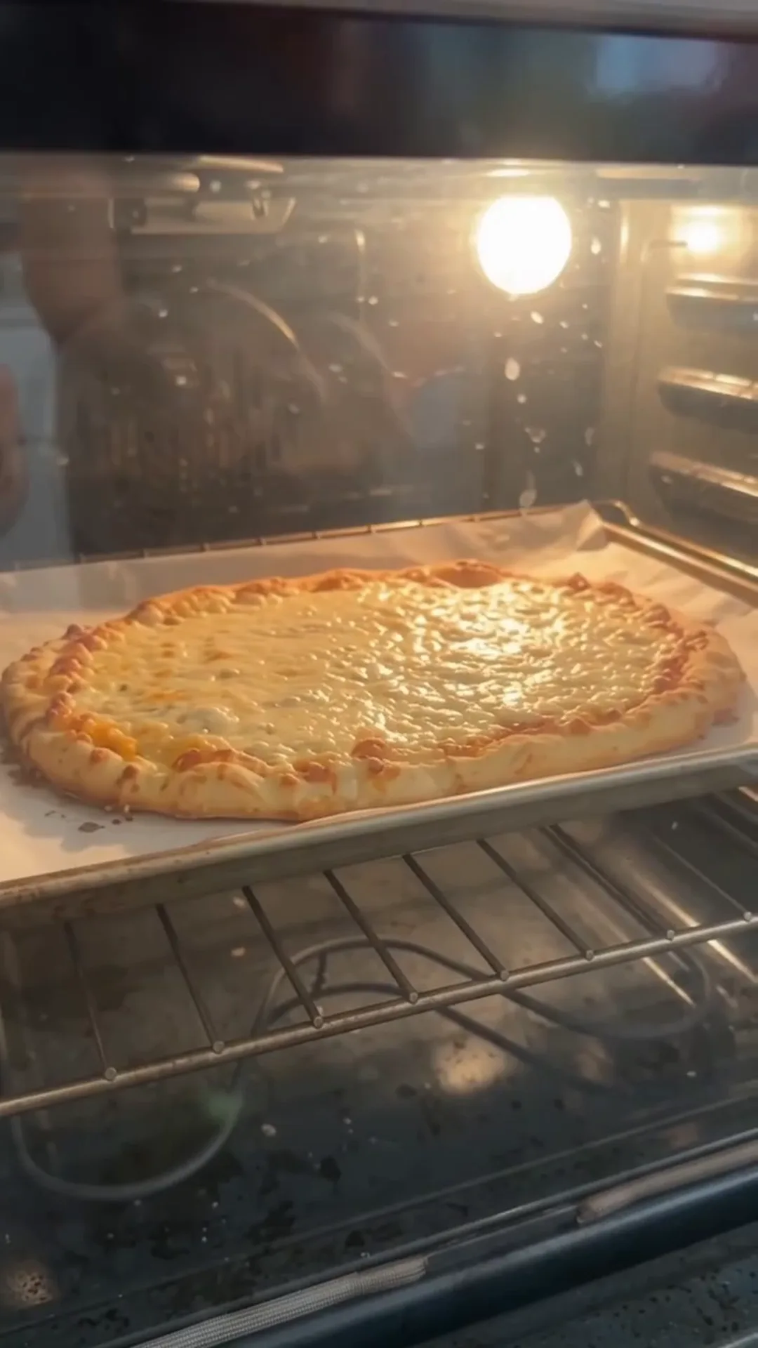 Crispy 3-Ingredient Cottage Cheese Pizza Crust – pizza is being baked in the oven
