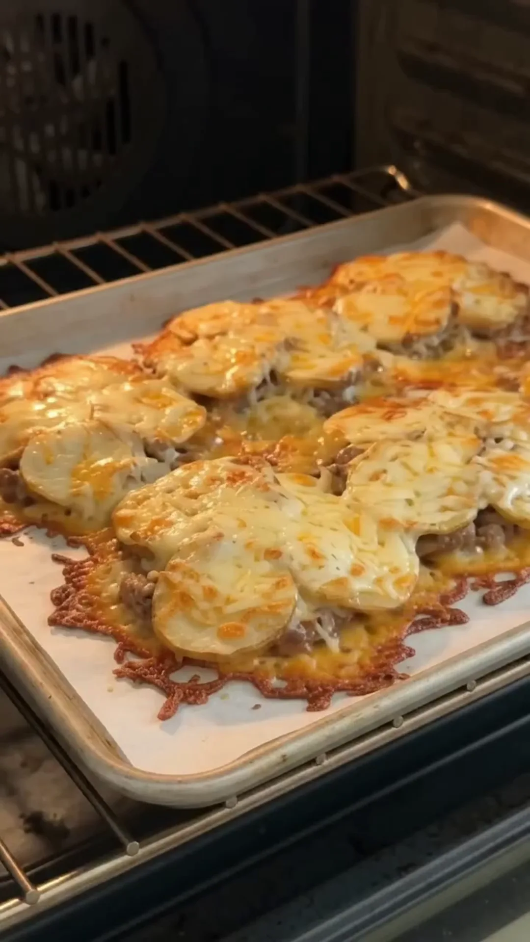 Crispy Potato Cheese Beef Tacos with Easy Sauce – baking a tray of food in an oven