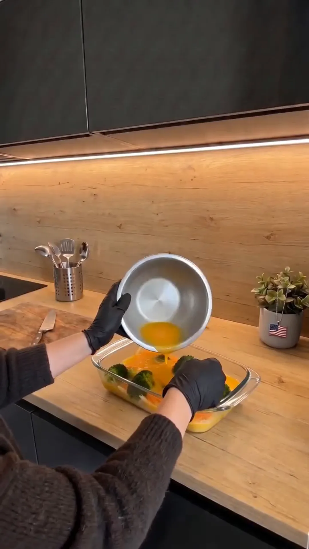 Easy Baked Broccoli Vegetable Omelet with Melted Cheese – Pouring orange liquid into a glass baking dish