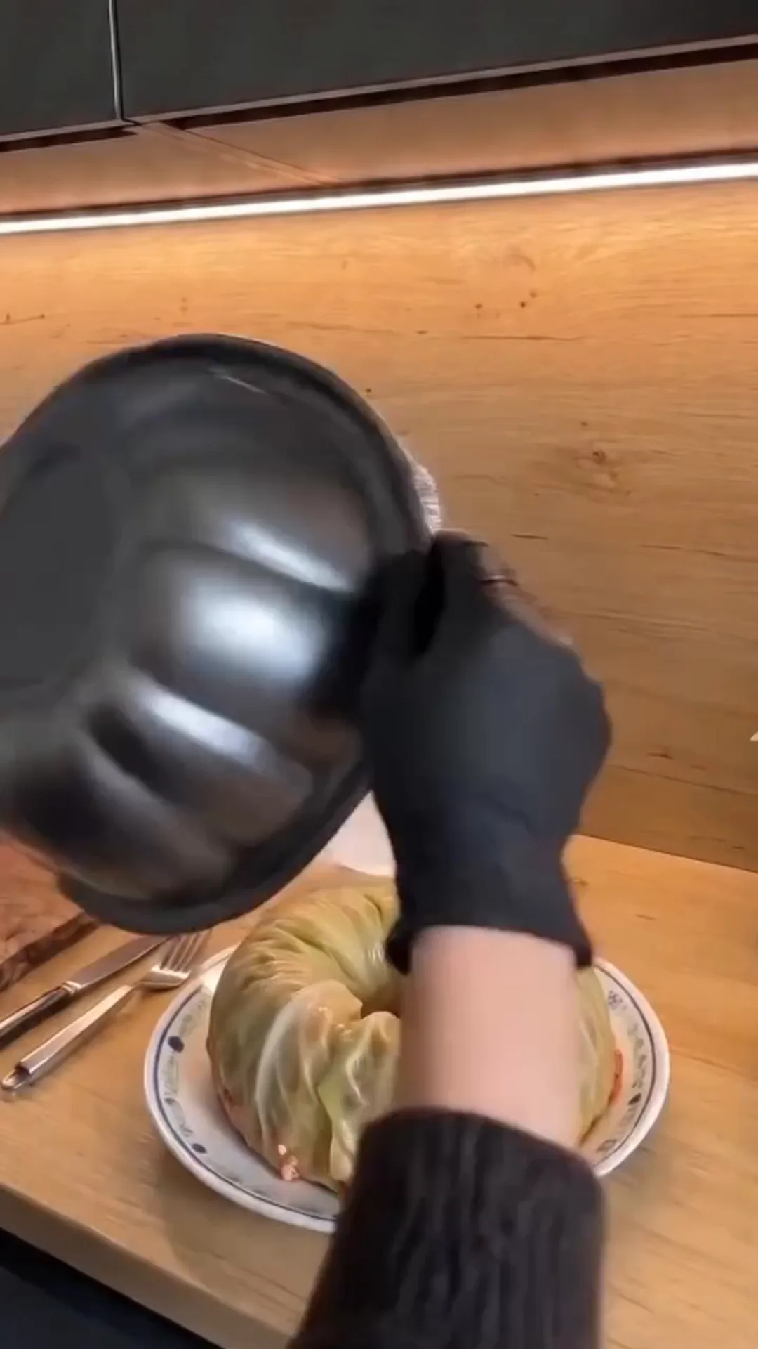Easy Bundt Pan Cabbage Roll Ring with Beef and Rice – Pouring liquid into a cabbage dish