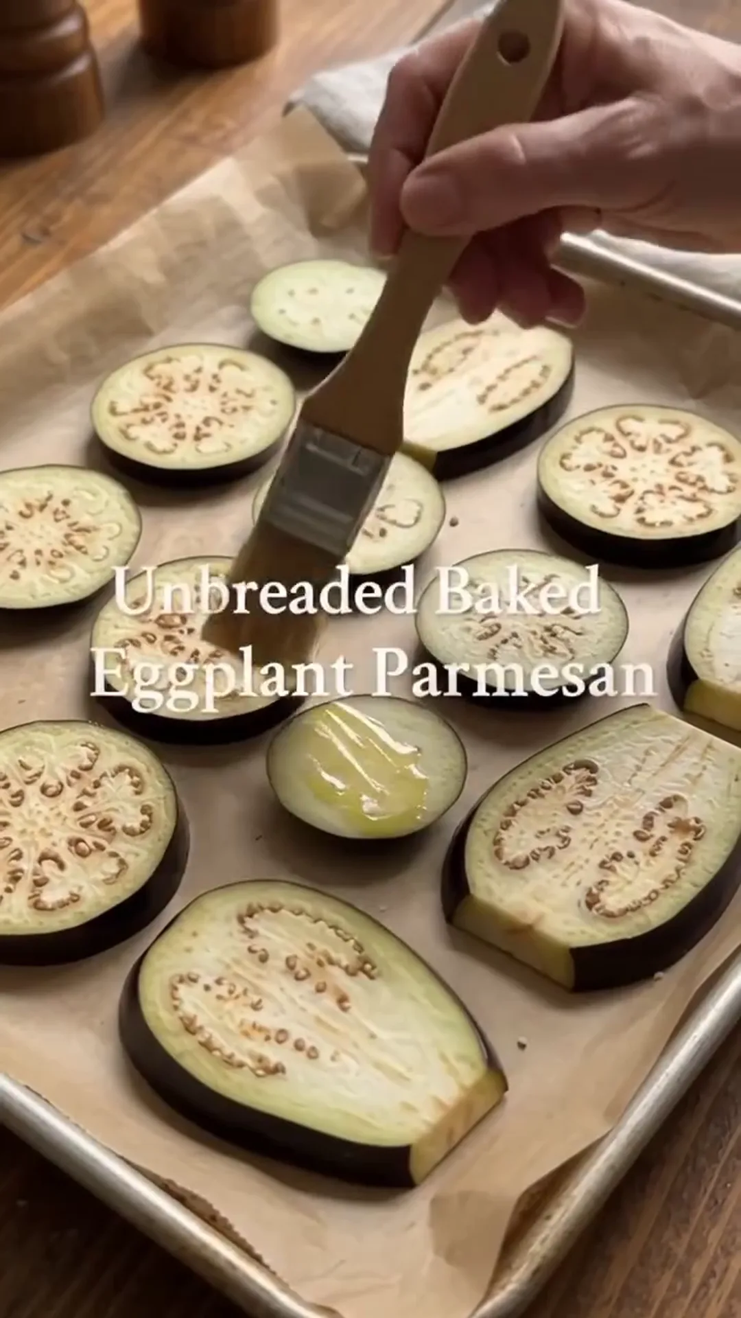 Easy Unbreaded Baked Eggplant Parmesan Recipe – brushing eggplant slices with oil
