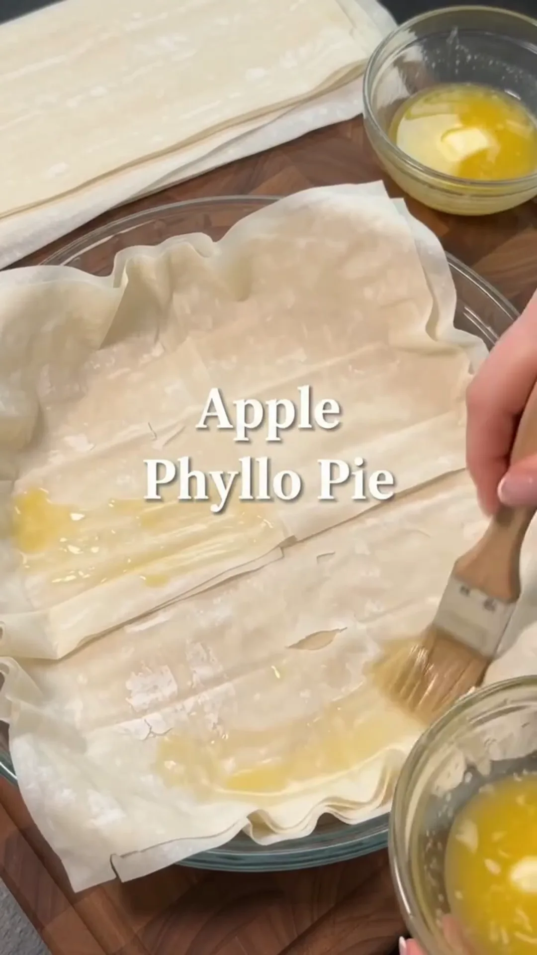 Elegant Apple Phyllo Pie with Cream Cheese Filling – brushing pastry with egg wash