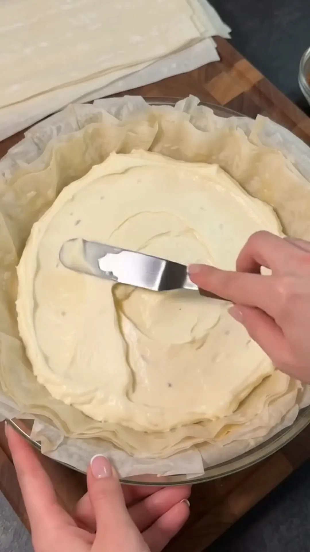 Elegant Apple Phyllo Pie with Cream Cheese Filling – spreading a filling on a pie crust