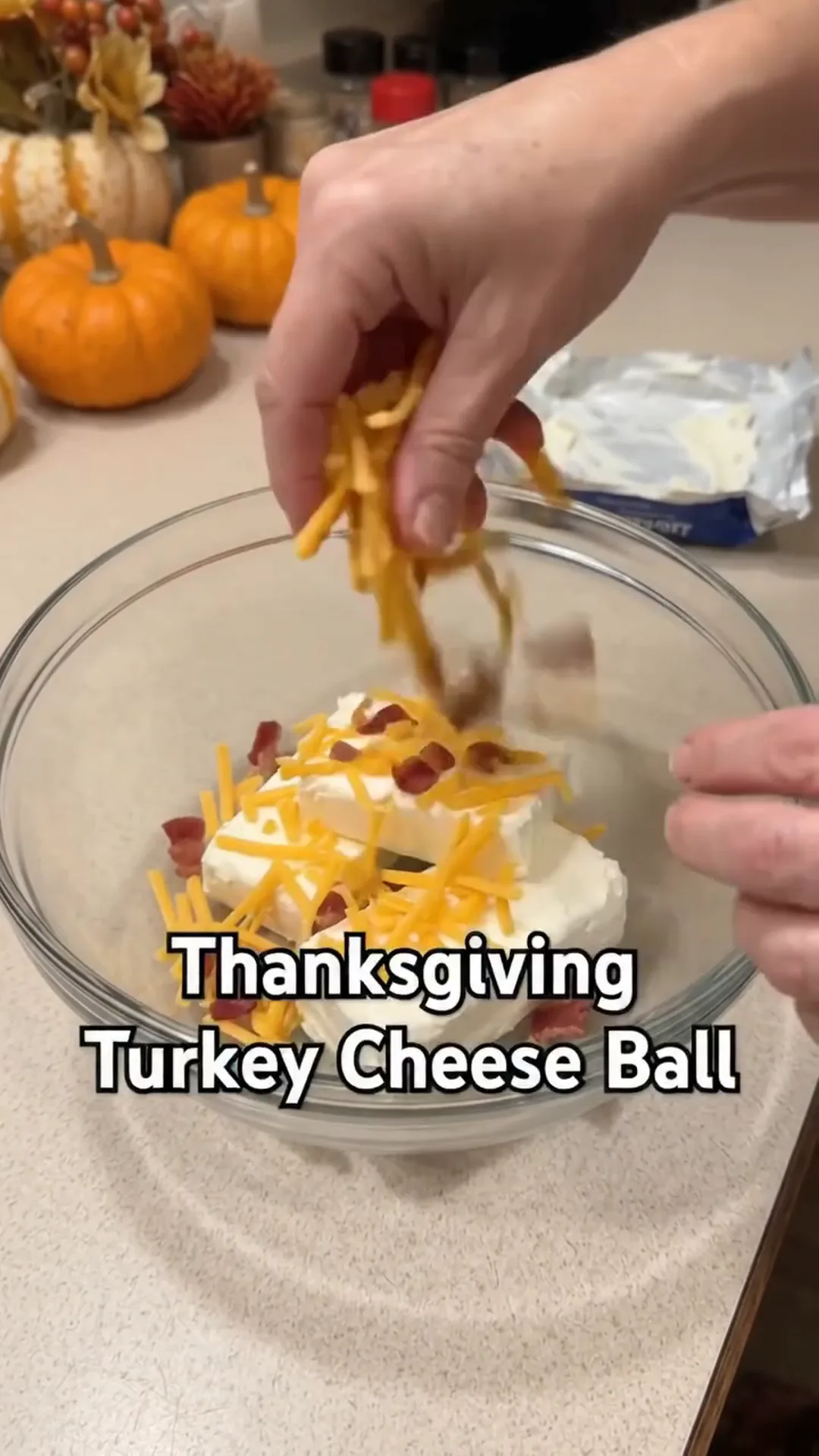 Festive Thanksgiving Turkey Cheese Ball with Crispy turkey bacon – Adding cheese to a bowl of cream cheese