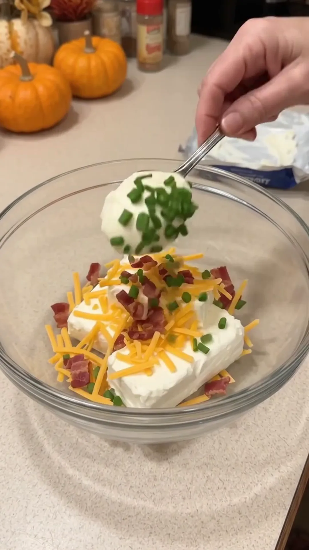 Festive Thanksgiving Turkey Cheese Ball with Crispy turkey bacon – Adding ingredients to a bowl