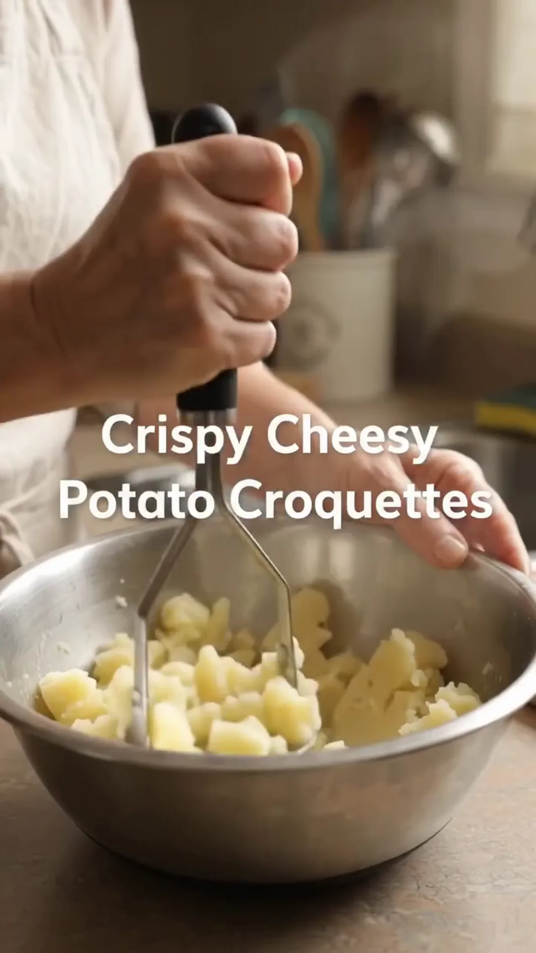 Golden Crispy Cheesy Potato Croquettes Recipe – mashing potatoes in a bowl