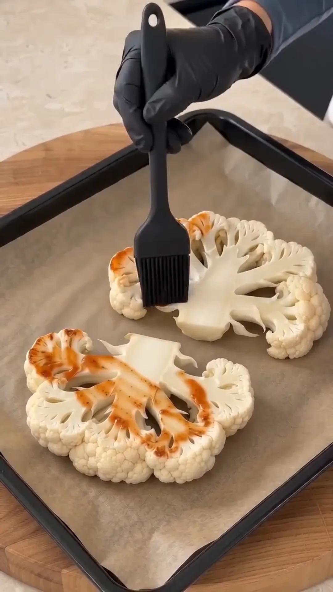 Hearty Cheesy Beef Cauliflower Steaks with Savory Ground Beef – brushing cauliflower with a sauce