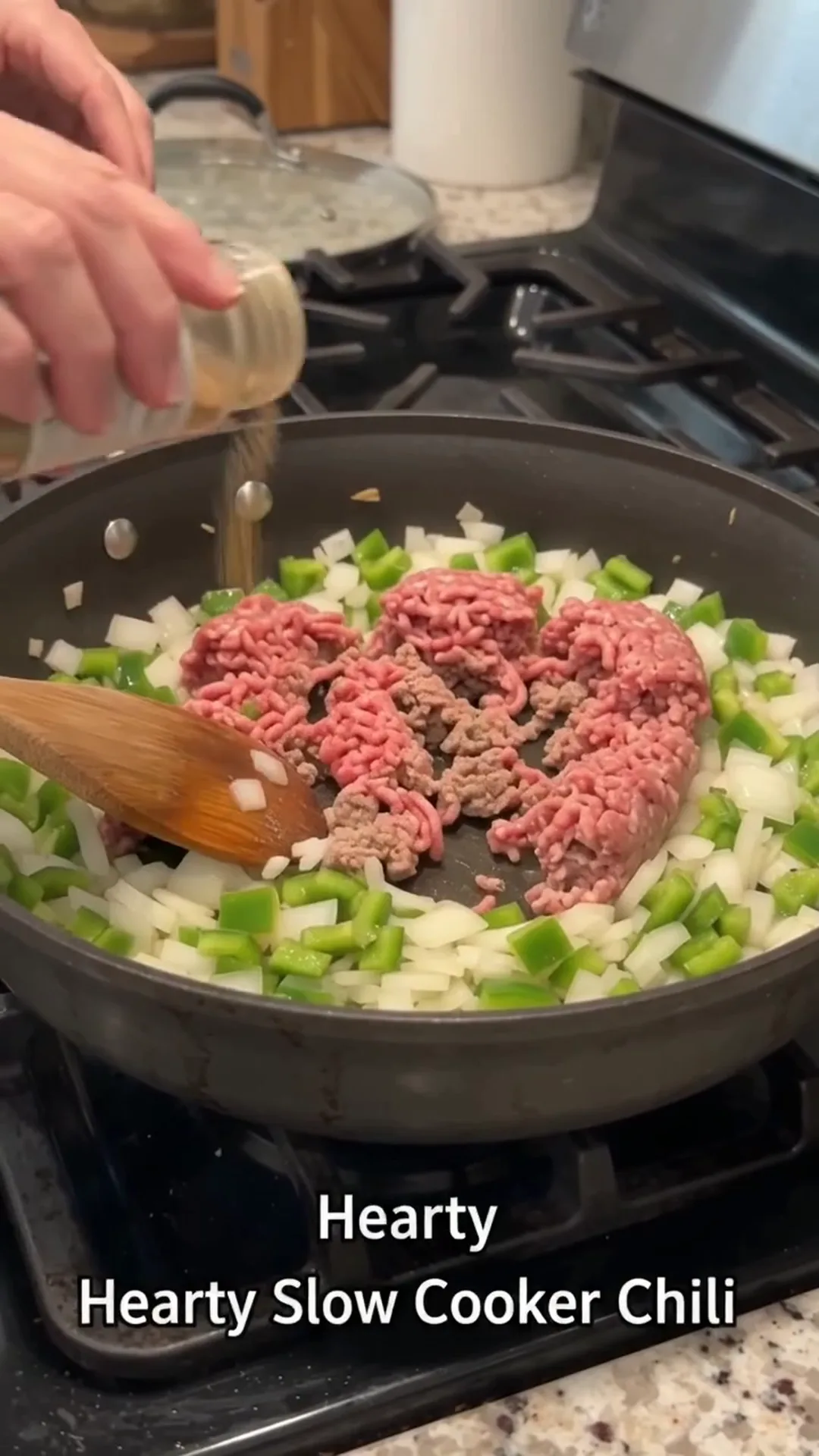 Hearty Slow Cooker Beef and Turkey Chili Recipe – person is cooking ground meat and vegetables in a pan