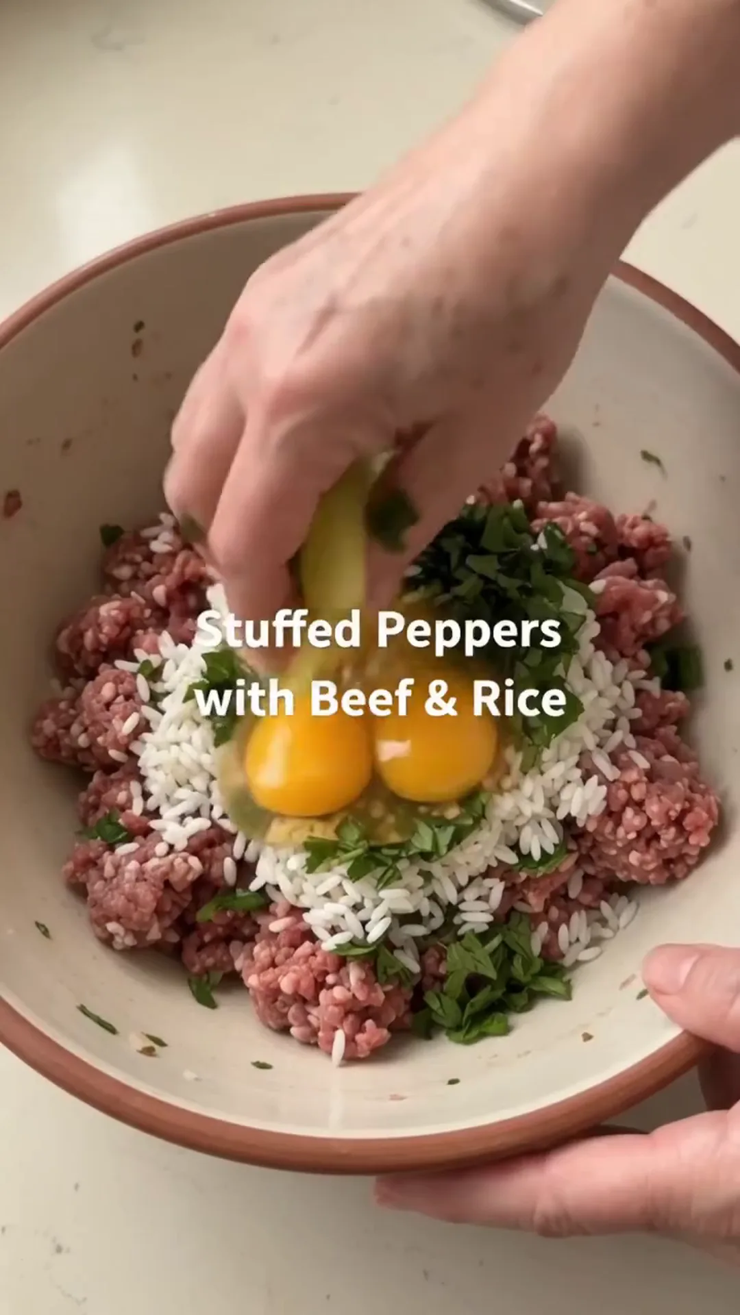 Hearty Stuffed Peppers with Beef and Rice over Mashed Potatoes – person mixing ingredients in a bowl