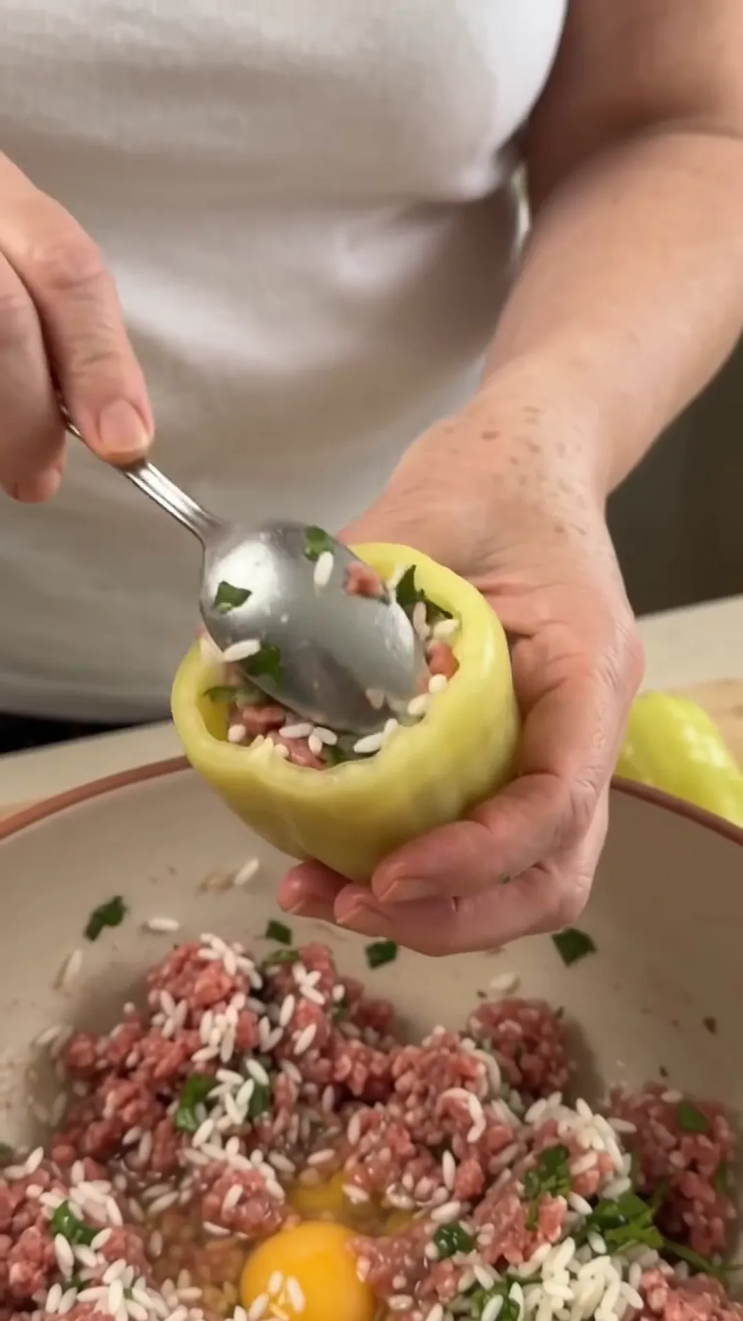 Hearty Stuffed Peppers with Beef and Rice over Mashed Potatoes – stuffing a pepper with rice and meat