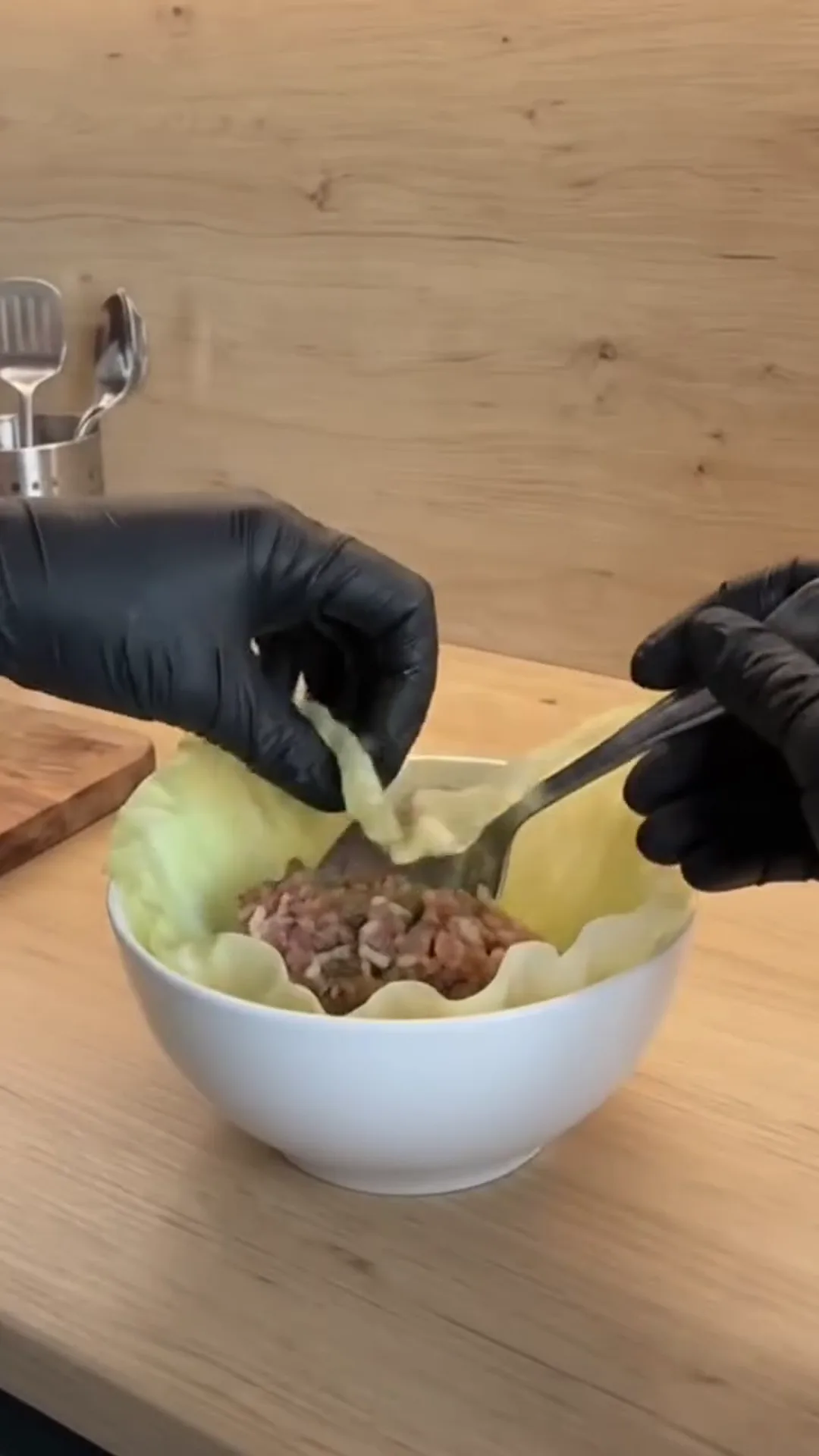 Individual Stuffed Cabbage Rolls with Ground Beef and Rice – person mixing ingredients in a bowl
