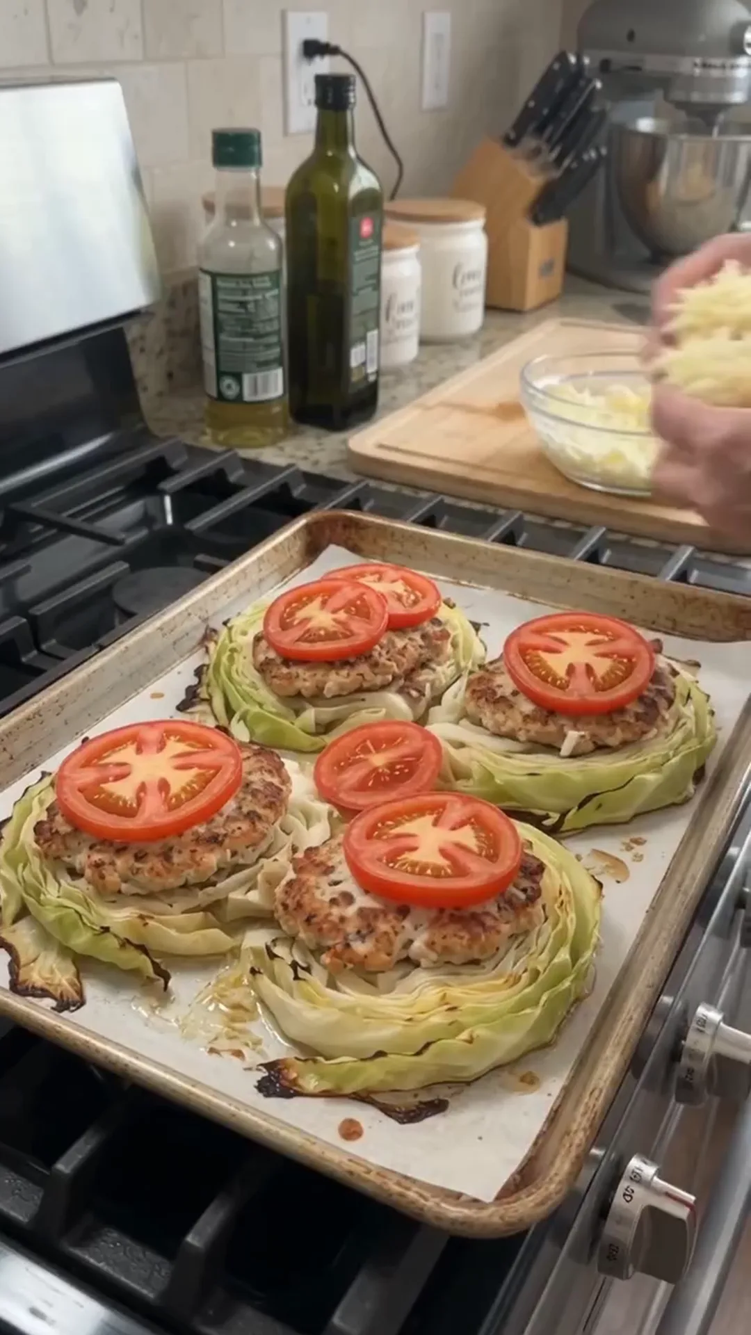 Loaded Cabbage Steaks with Ground Chicken and Mozzarella – Preparing food on a baking tray, possibly burgers or patties
