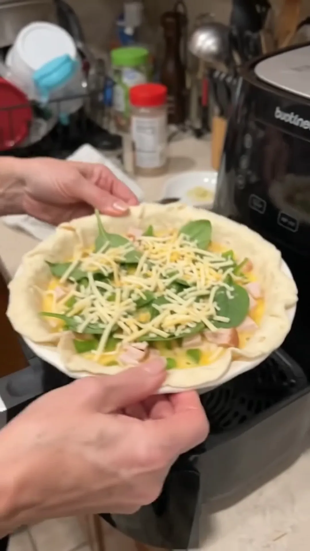 Quick Cauliflower Pizza Steaks with Smoked Turkey and Cheese – person placing food in a pan