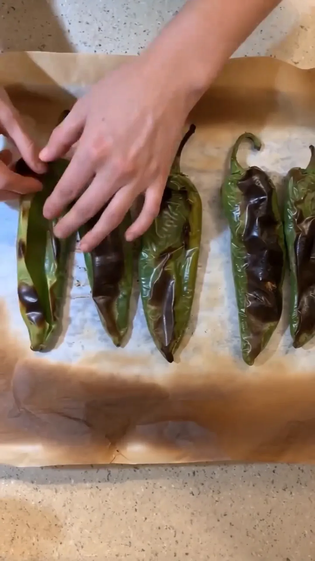 Roasted Anaheim Chile Tacos with Seasoned Beef and Cheese – roasting peppers on a baking sheet