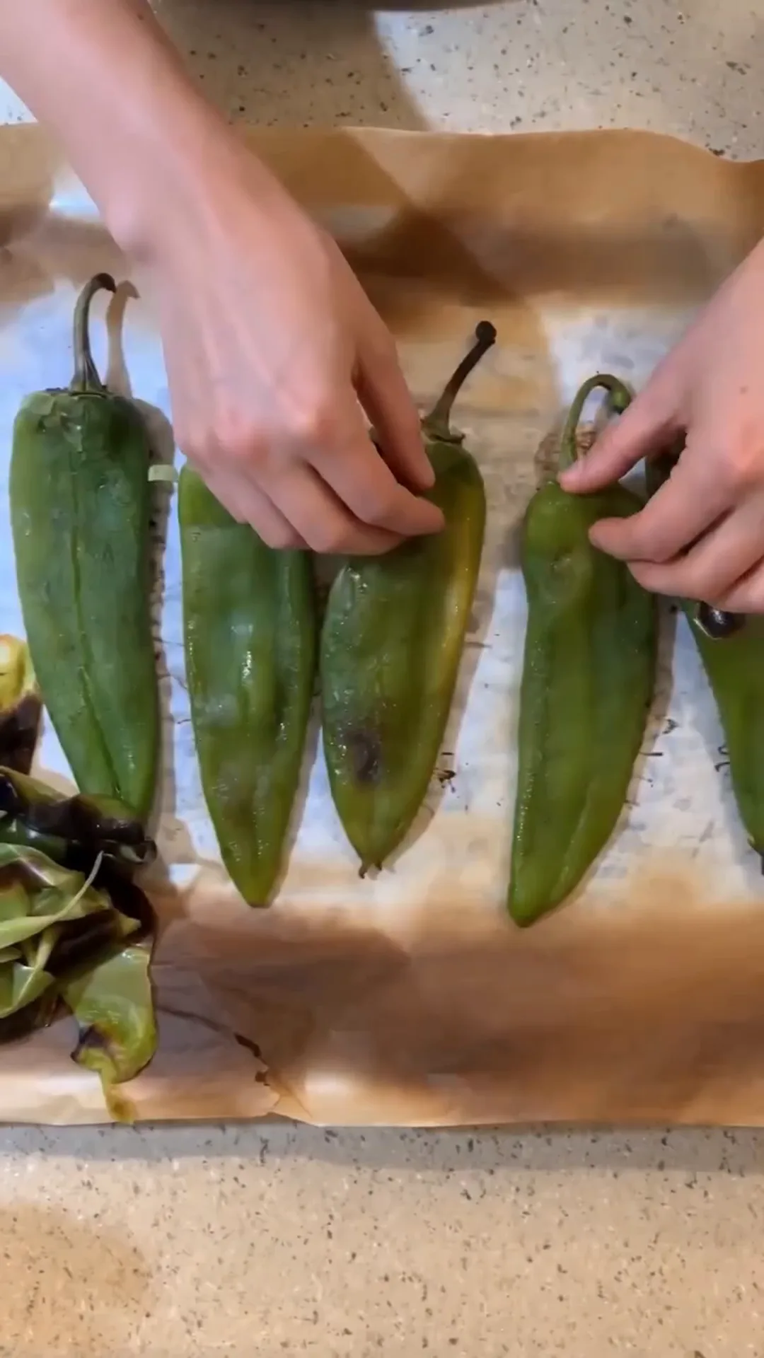 Roasted Anaheim Chile Tacos with Seasoned Beef and Cheese – roasting peppers on a baking sheet
