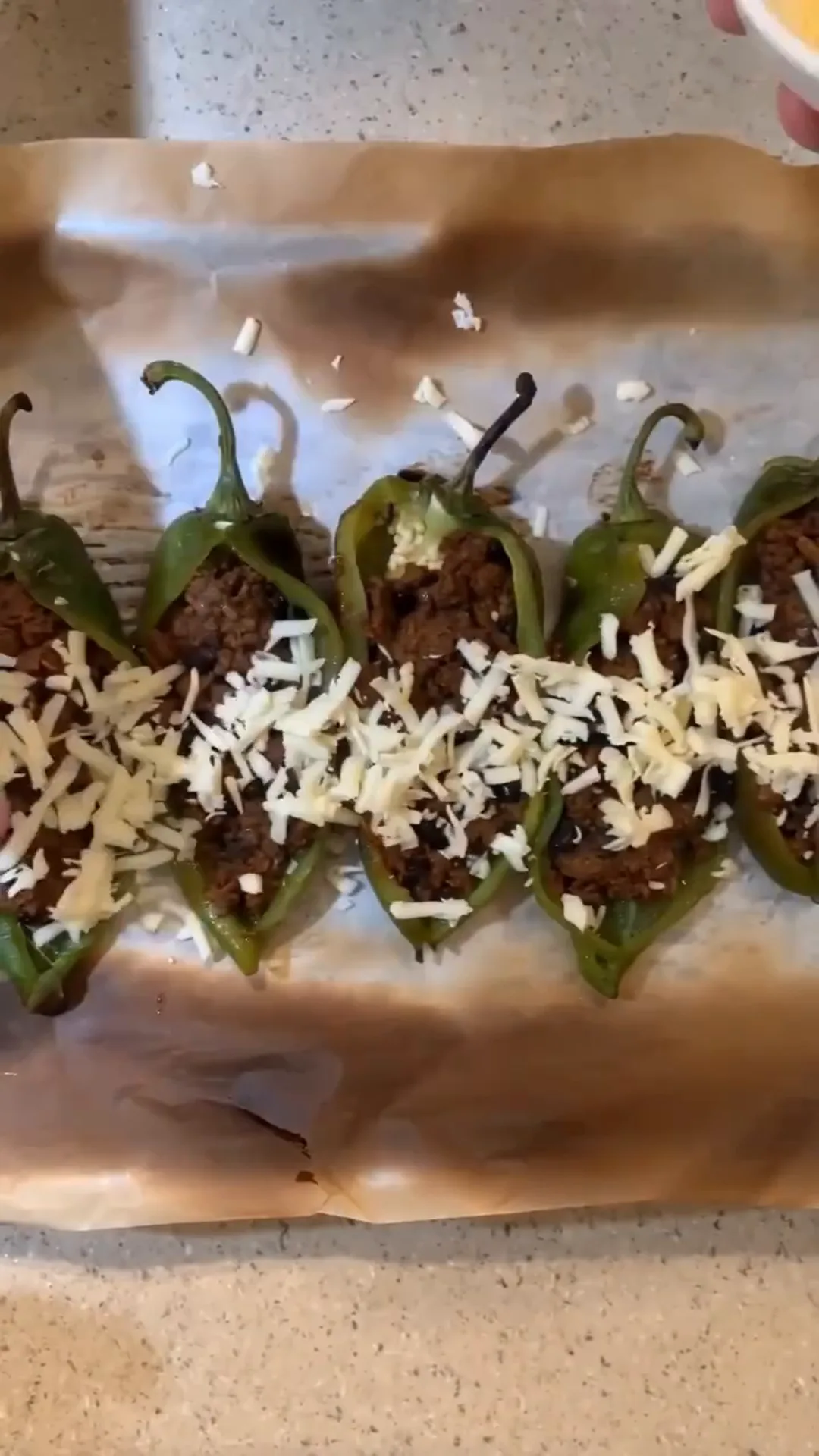Roasted Anaheim Chile Tacos with Seasoned Beef and Cheese – stuffed peppers with cheese being prepared