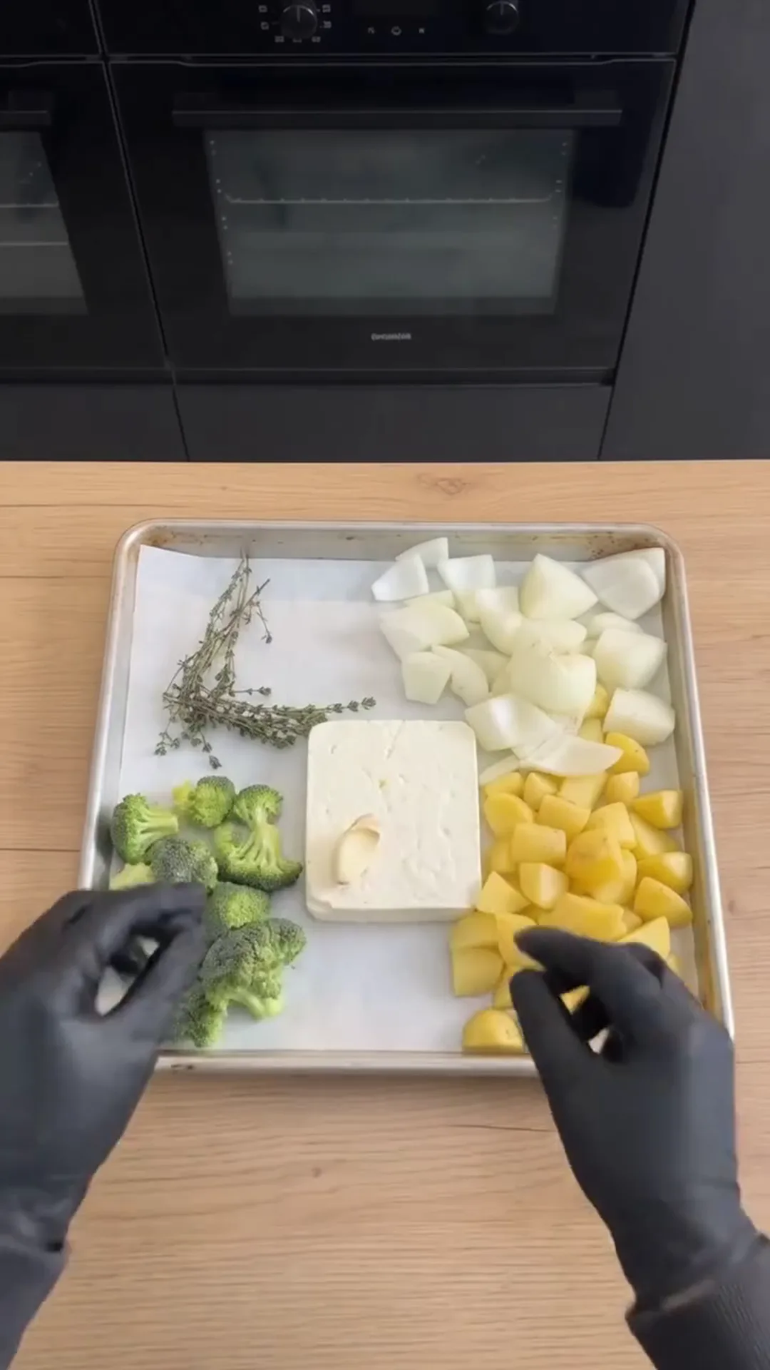 Roasted Broccoli and Feta Soup with Roasted Garlic – Preparing vegetables for roasting, placing on a tray