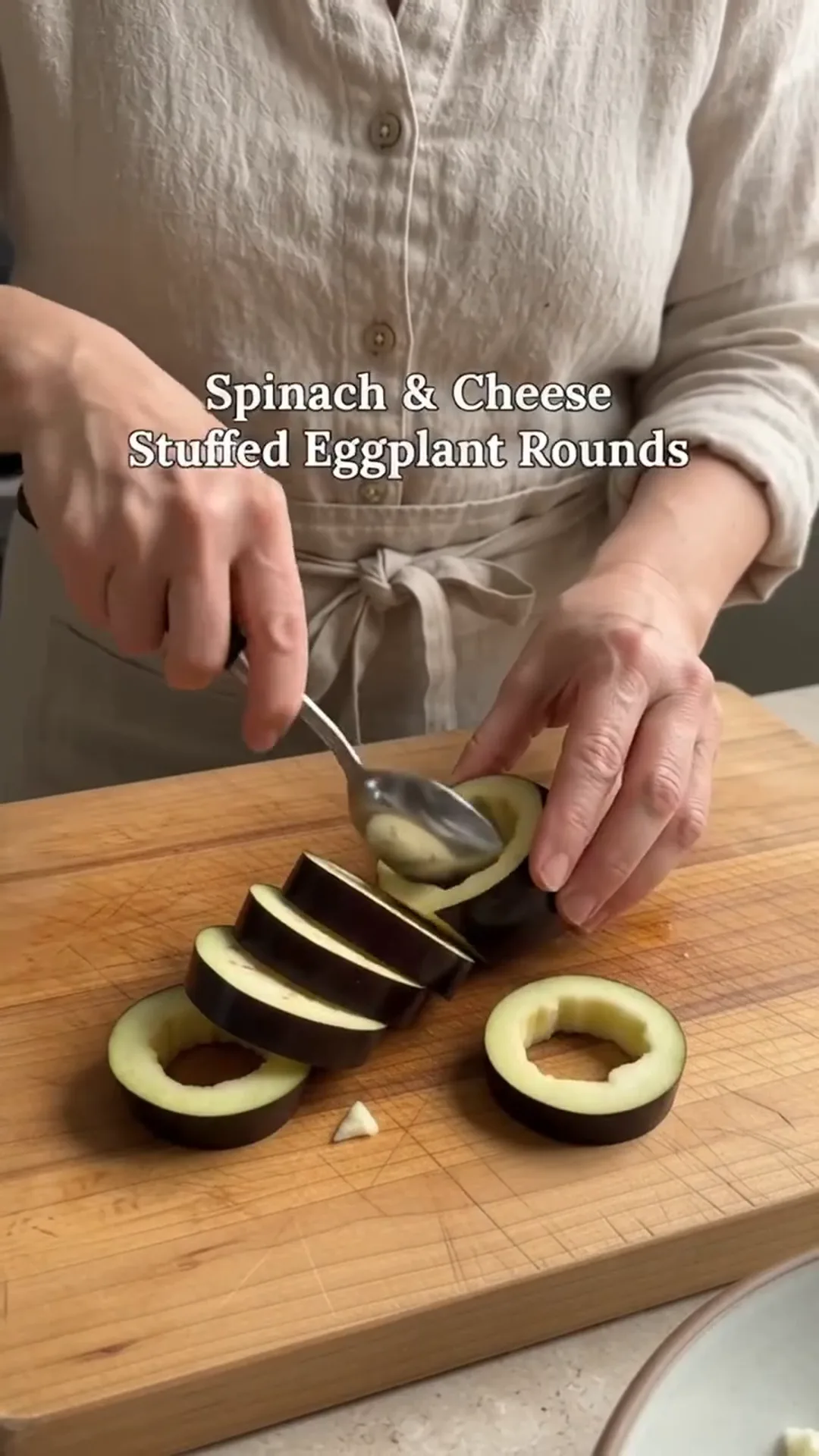 Roasted Spinach and Cheese Stuffed Eggplant Rounds – spooning eggplant filling into a round