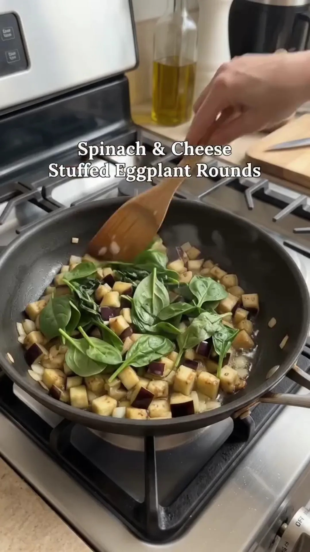 Roasted Spinach and Cheese Stuffed Eggplant Rounds – stirring a pan of food on a stove