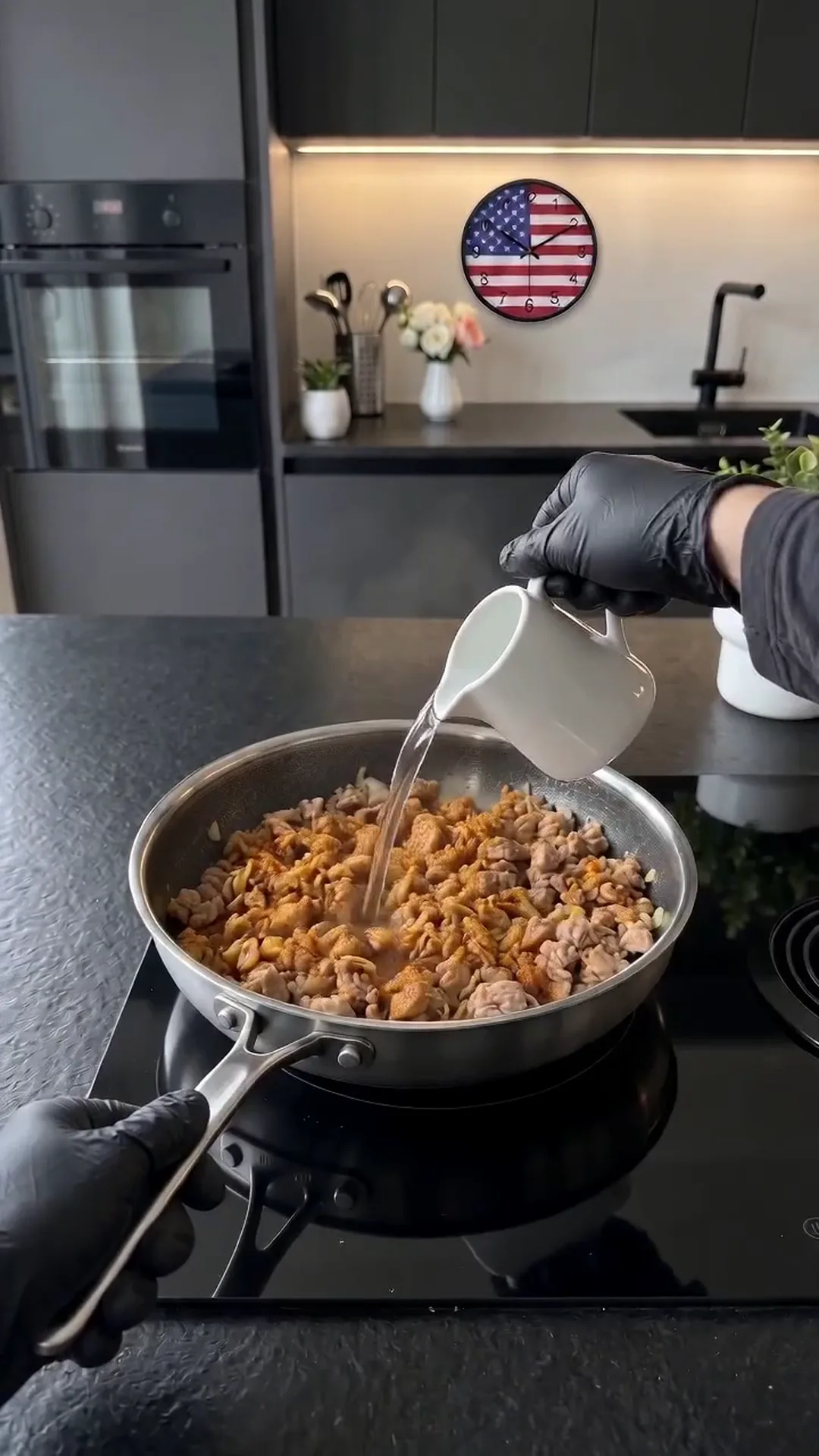 Savory Pan-Seared Cabbage and Ground Chicken Skillet Recipe – Pouring liquid into a pan with meat and vegetables