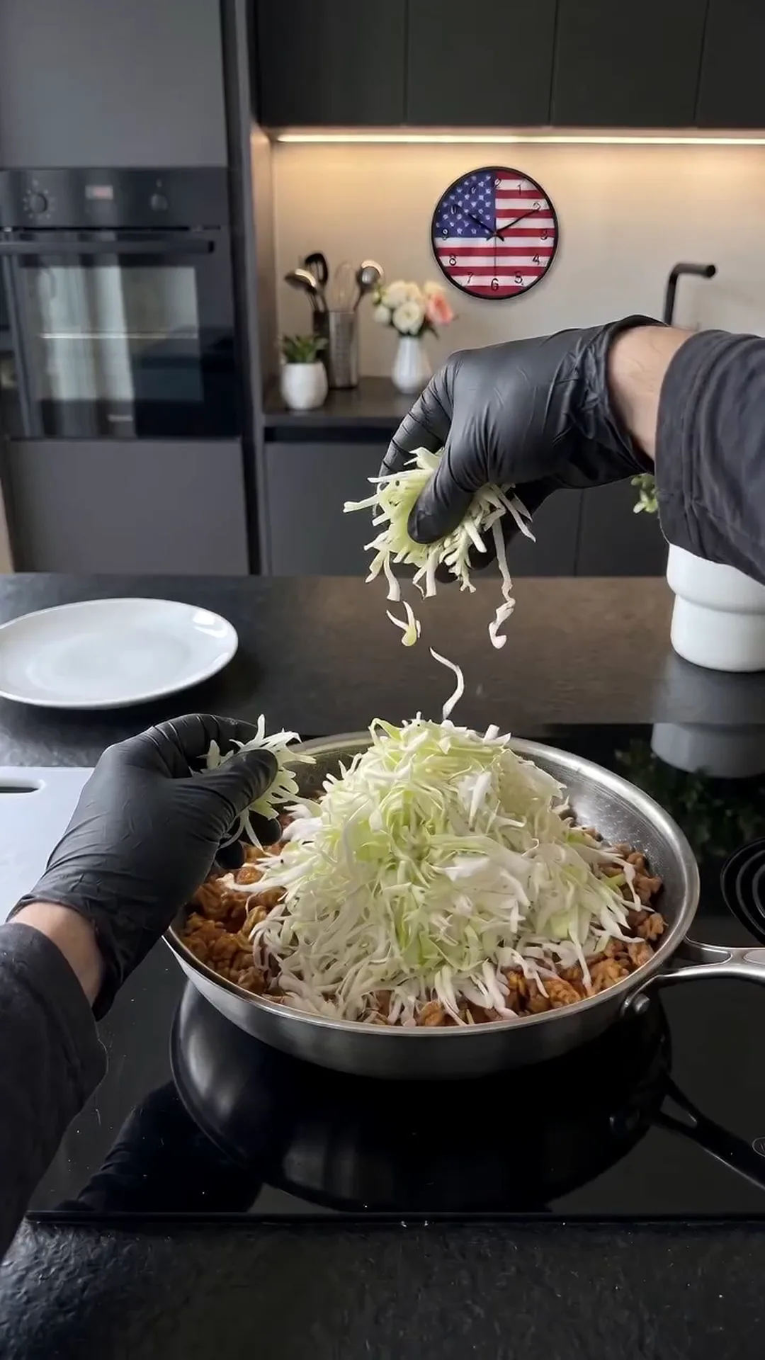 Savory Pan-Seared Cabbage and Ground Chicken Skillet Recipe – adding shredded lettuce to a pan of food