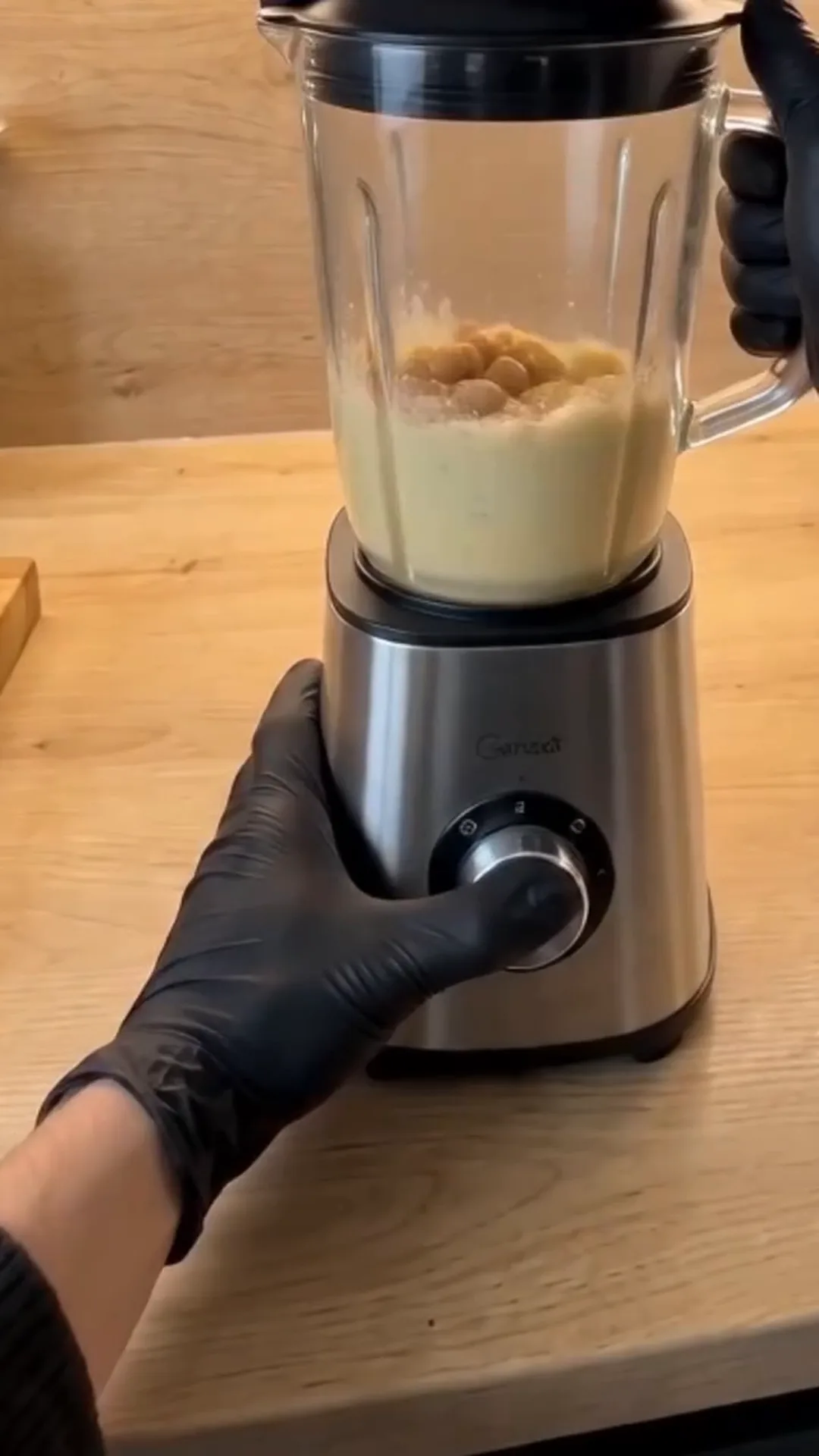 Seared Broccoli Steaks with Chimichurri and Butter Bean Purée – person is using a blender to mix ingredients