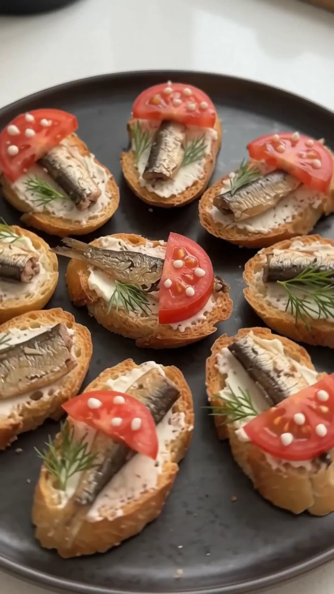 Smoked Sprat and Cream Cheese Baguette Bites – small sandwiches are being prepared