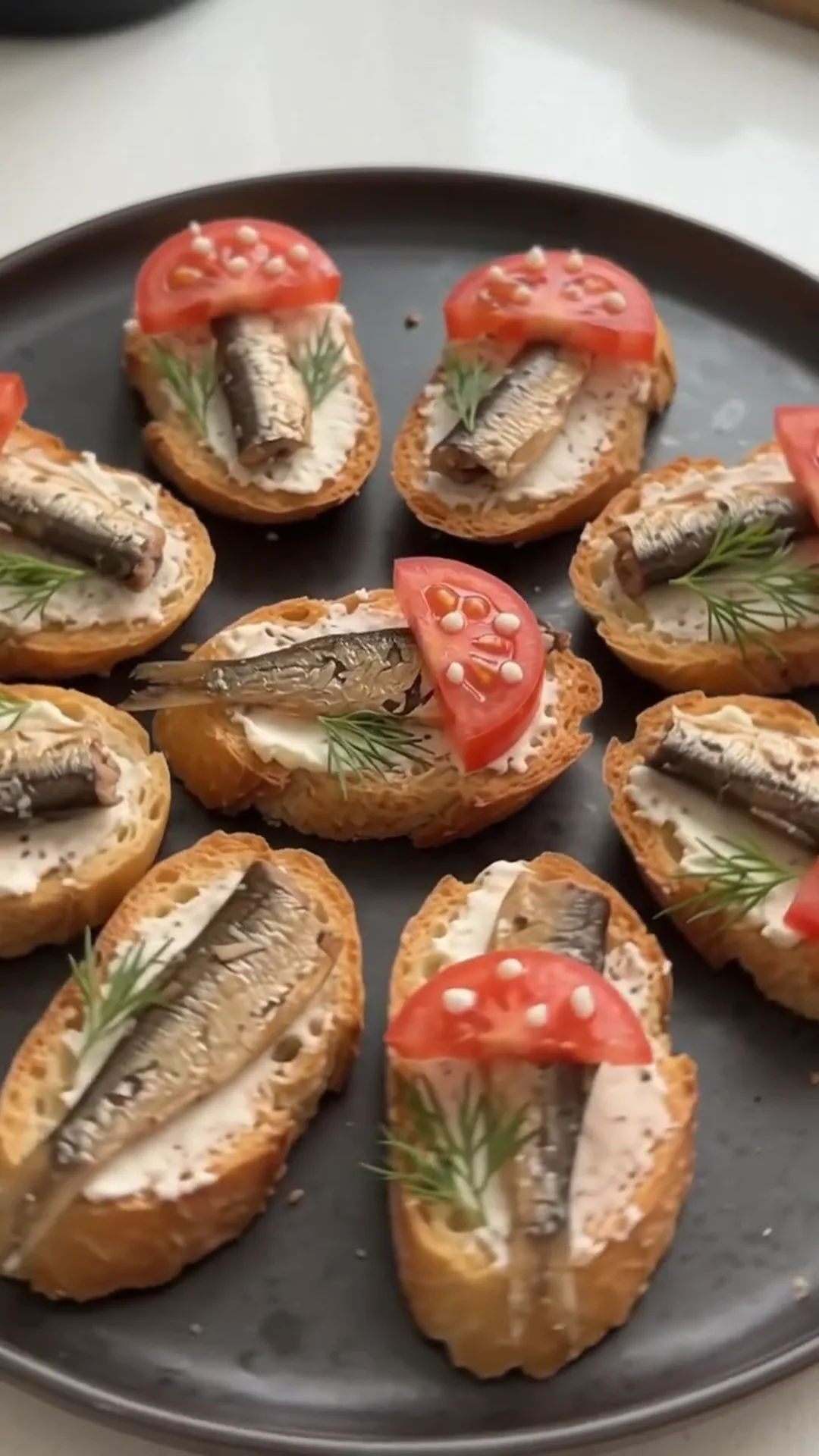 Smoked Sprat and Cream Cheese Baguette Bites – small sandwiches are being prepared