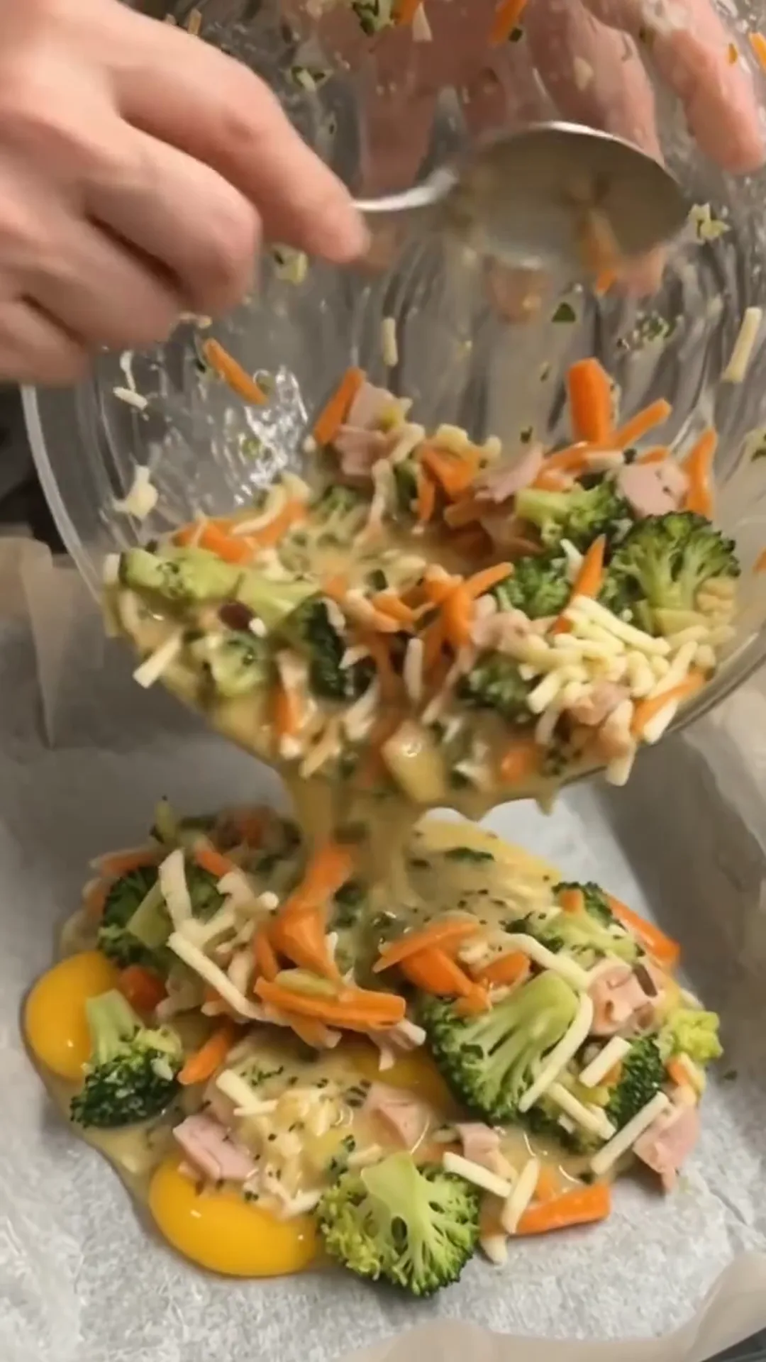 Smoked Turkey and Broccoli Egg Frittata Bake – Pouring a mixture of eggs, vegetables, and cheese into a baking dish
