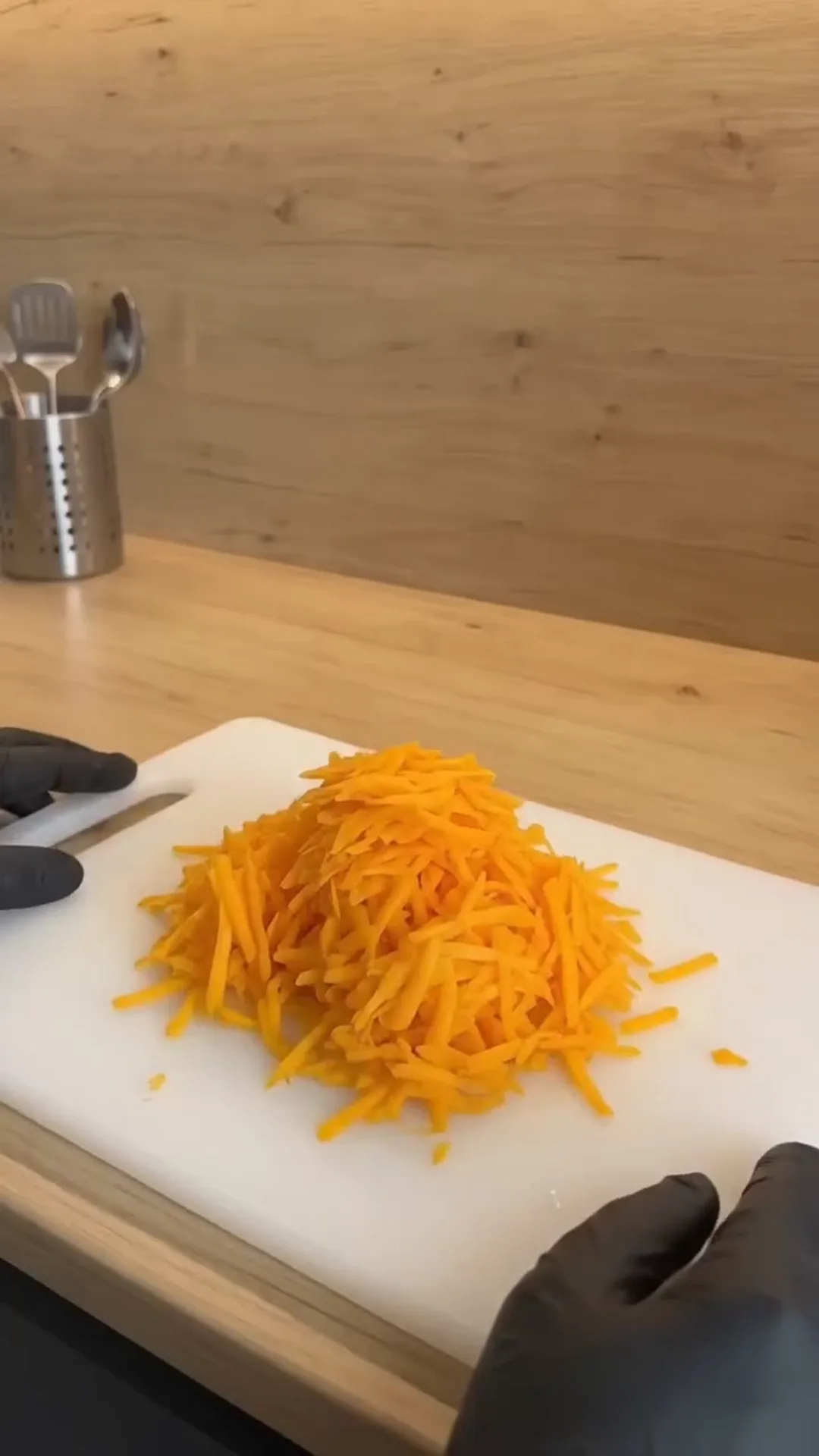 Spiced Pumpkin Loaf Cake with Cream Cheese Filling – Someone is grating cheese on a cutting board