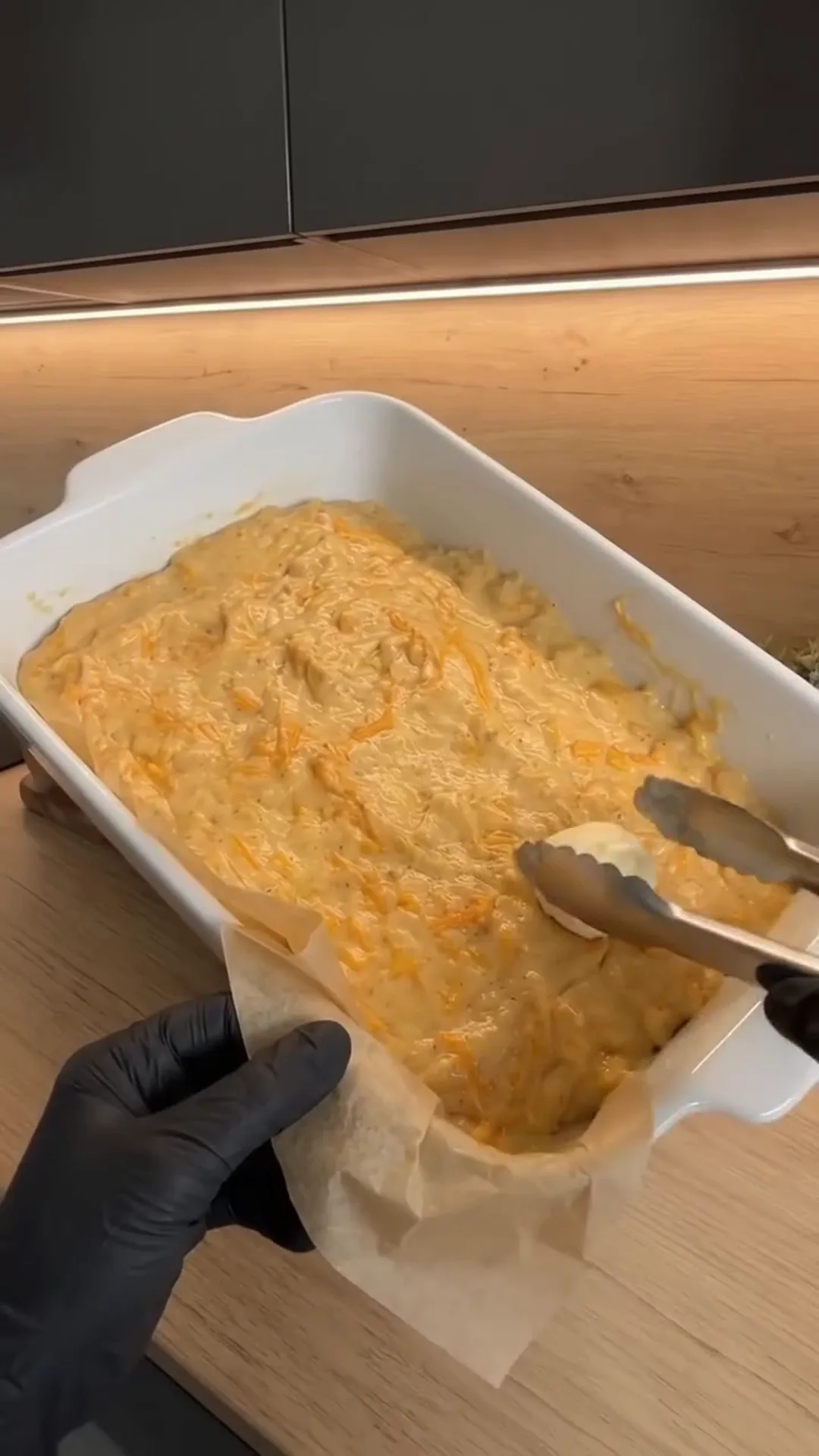Spiced Pumpkin Loaf Cake with Cream Cheese Filling – mixing batter in a white baking dish