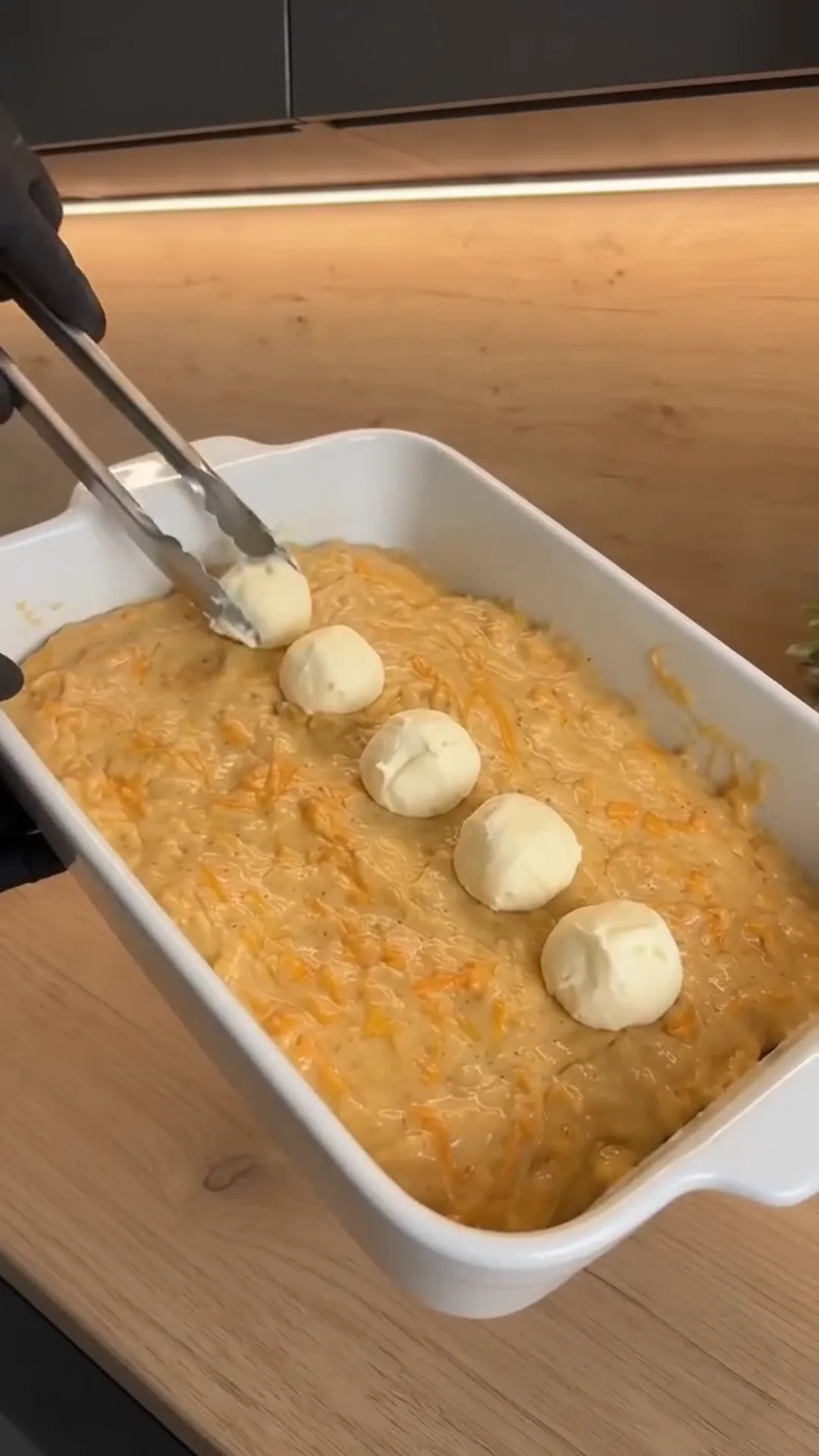 Spiced Pumpkin Loaf Cake with Cream Cheese Filling – Adding small balls of cheese to a casserole dish