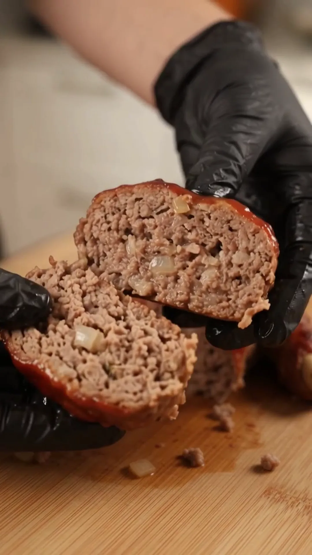 Spooky Halloween Hand Meatloaf Centerpiece – Someone is cutting a meatloaf into slices