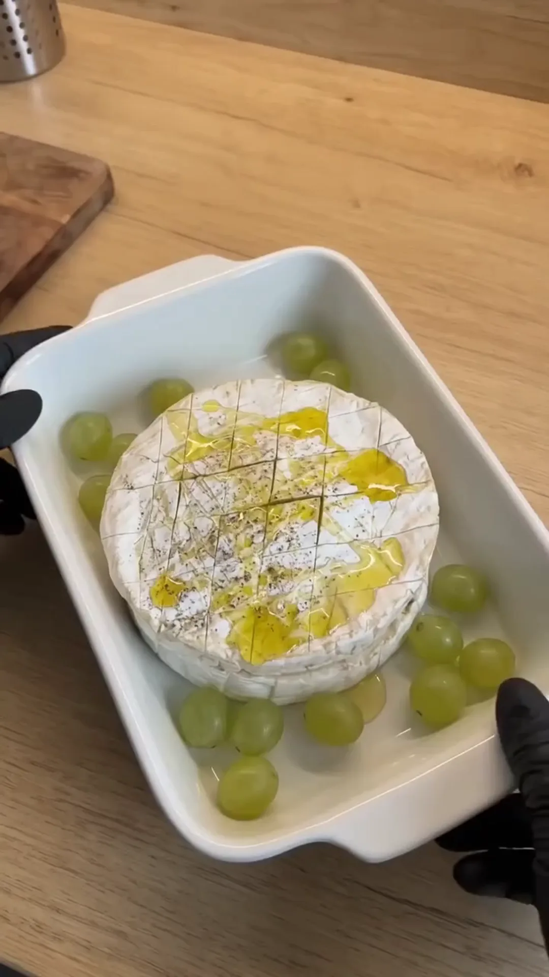 Warm Baked Camembert with Sweet Berries and Roasted Grapes – baking cheese in a dish with grapes