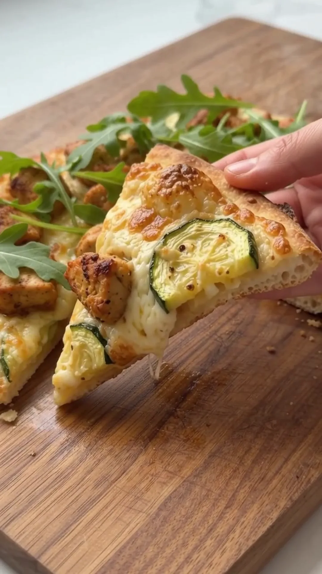 Zucchini Tawouk Flatbread with Savory Chicken – serving pizza