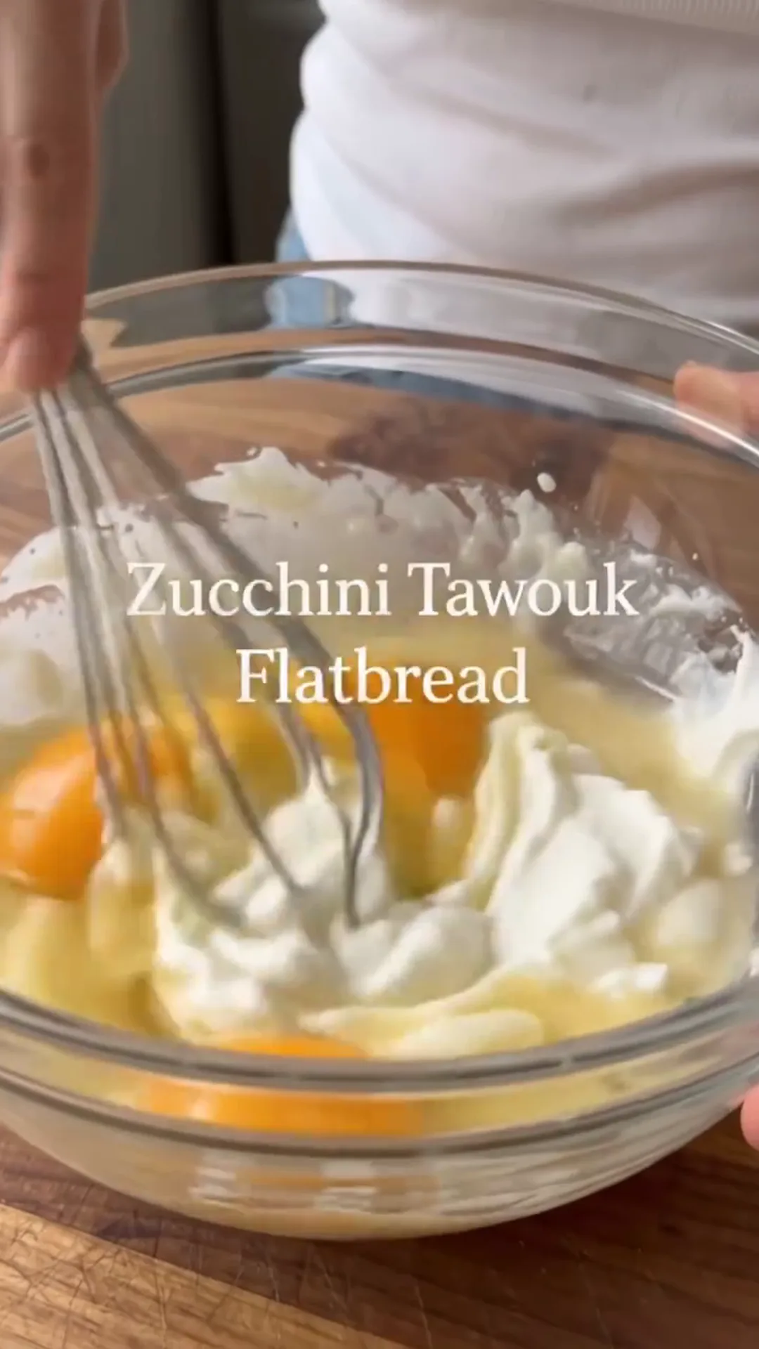 Zucchini Tawouk Flatbread with Savory Chicken – whisking eggs and cream in a bowl