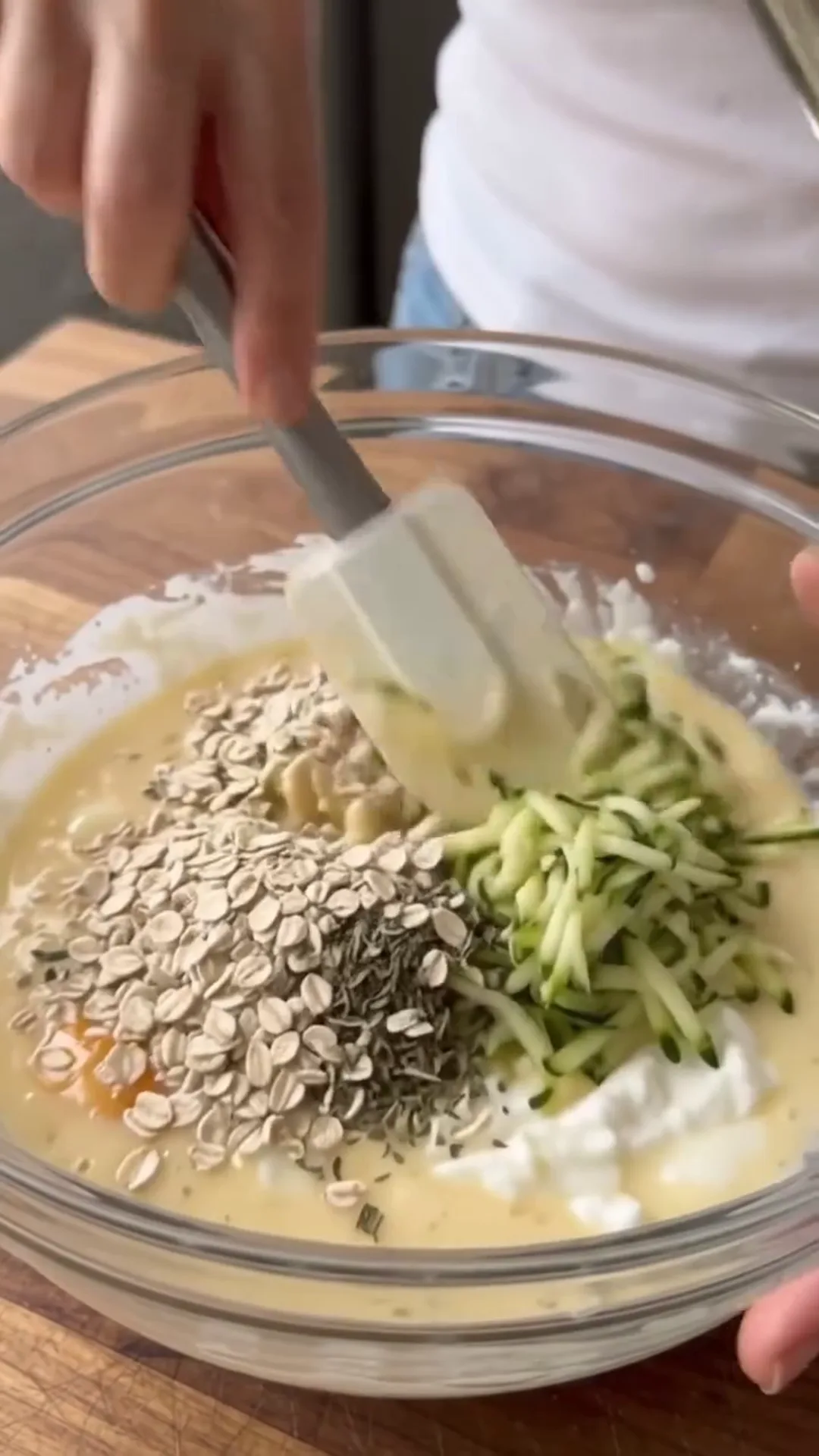 Zucchini Tawouk Flatbread with Savory Chicken – mixing ingredients in a bowl